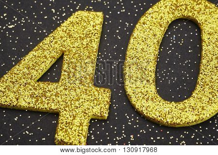 Number forty yellow color over a black background. Anniversary. Horizontal