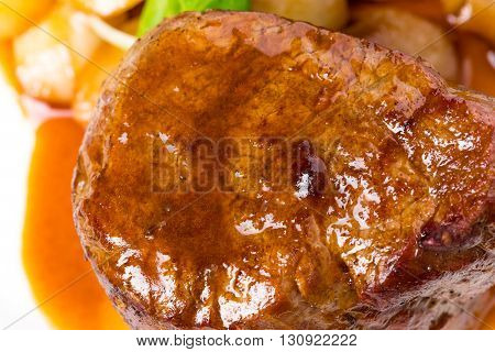 Delicious beef steak in demiglas sauce. Macro. Photo can be used as a whole background.