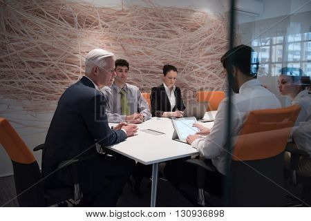 business people group brainstorming on meeting and businessman presenting ideas and projects oon laptop and tablet computer