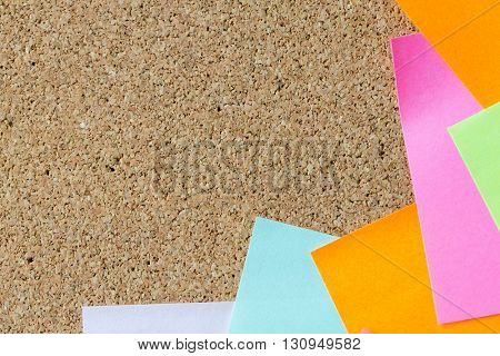 business, information, memo, management and education concept - close up of blank paper stickers on cork board