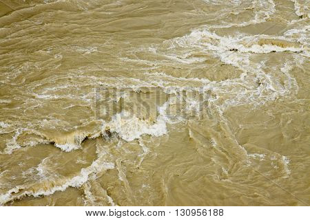 Raging waters and murky - full frame background