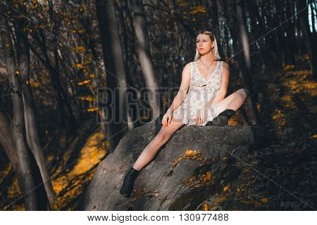 Sexy girl in the woods beauty style fashion