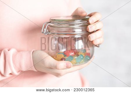 Female Holg Glass Jar With Jelly In Hand