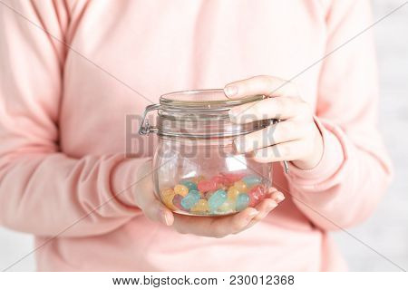 Female Holg Glass Jar With Jelly In Hand