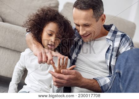Teaching My Daughter. Handsome Happy Dark-haired Man Smiling And Teaching His Daughter To Count On H