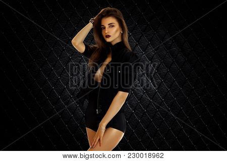Cute Young Girl In Black Jacket And High Panties Without Bra Under Posing On Camera Isolated On Whit