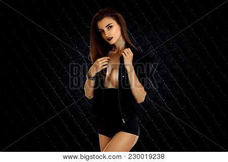 Brunette Girl With Silicon Breasts In Black Jacket And Panties Isolated On White Background