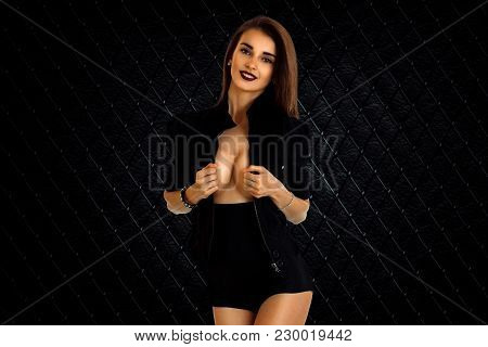 Attractive Girl With Big Brests In Jacket And High Panties Isolated On White Background