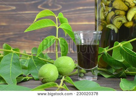 Close Up Of Green Walnut Liqueur Nocino