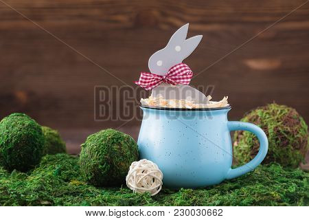 Wooden Polka Dot Grey Rabbit In A Blue Cup On The Grass Background, Easter Postcard Concept, Toned