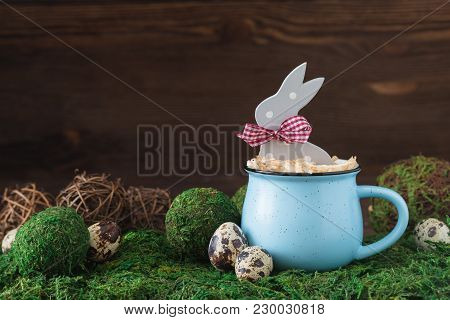 Wooden Polka Dot Grey Rabbit In A Blue Cup On The Grass Background, Easter Postcard Concept, Toned