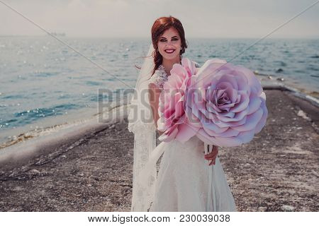 Night Wedding Ceremony. The Bride And Groom Hugging On Sea Pier