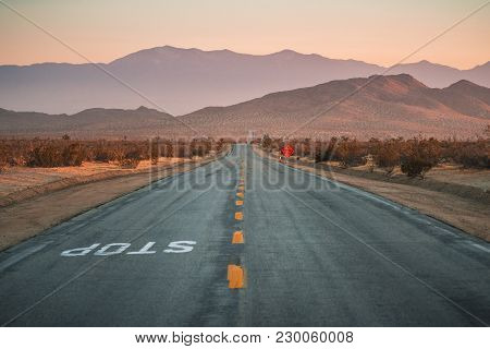 Middle Of Desert Road Vanishing Point And Mountains