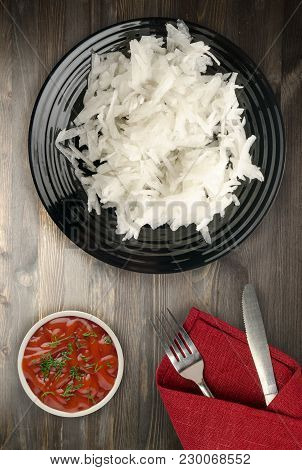 Daikon On A Wooden Background. Daikon On A Plate
