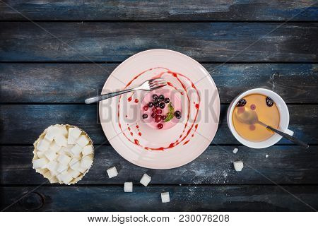 Caramel Cheesecake With Strawberry And Sugar, Served With Cup Of Tea, Cutlery And Loaf-sugar. On The