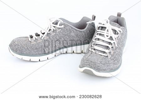 Gray Sneakers With Red Laces On A White Background
