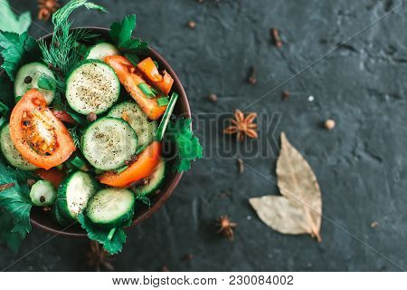 Fresh Salad With Vegetables On A Black Matte Background. The Concept Of A Healthy Diet.