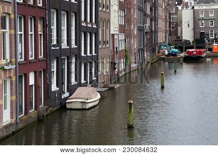 Amsterdam, Netherlands - June 25, 2017: View From The Prins Hendrikkade Street To The Old Historical