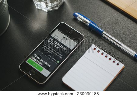 Malaga, Spain - March 6, 2018: Mobile Phone With Ello App In The Screen, Placed On A Black Desk With
