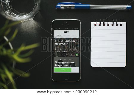 Malaga, Spain - March 6, 2018: Mobile Phone With Ello App In The Screen, Placed On A Black Desk With