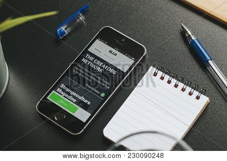 Malaga, Spain - March 6, 2018: Mobile Phone With Ello App In The Screen, Placed On A Black Desk With
