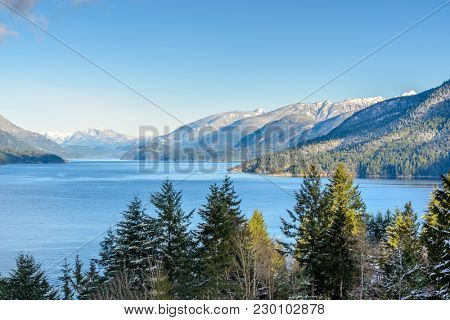 Fantastic view over ocean, snow mountain and rocks at Sechelt inlet in Vancouver, Canada.