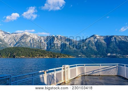 Fantastic view over ocean, snow mountain and rocks at Sechelt inlet in Vancouver, Canada.
