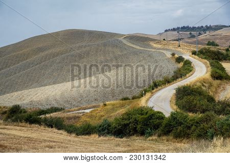 Country Landscape Along The Road From Asciano To Torre A Castello, Siena, Tuscany, Italy, At Summer