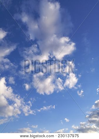 Blue Sky And White Clouds. Background Heaven.
