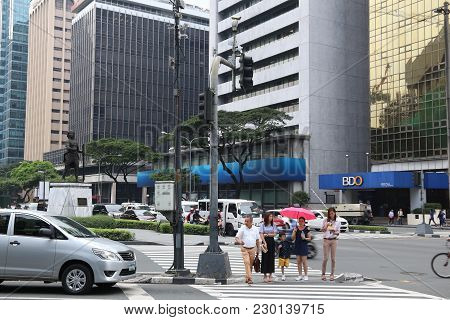 Manila, Philippines - December 7, 2017: People Visit Makati City, Metro Manila, Philippines. Metro M