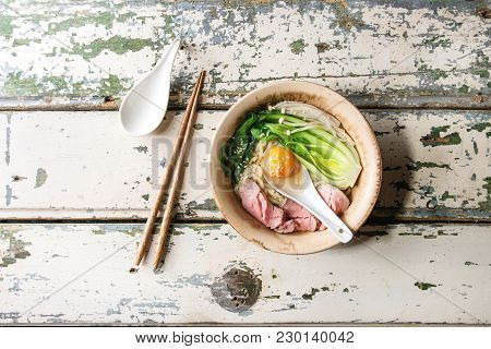 Asian Dish Udon Noodles With Egg Yolk, Sesame, Mushrooms, Boc Choy, Sliced Sous Vide Cooked Meat Ser