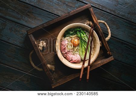 Asian Dish Udon Noodles With Egg Yolk, Sesame, Mushrooms, Boc Choy, Sliced Sous Vide Cooked Meat Ser