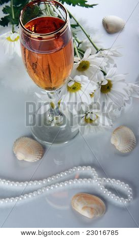 Glass With Wine And A Pearl Necklace