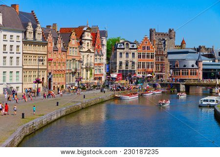 Gent - May 26: Unidentified Tourists Visiting Historical Center Of Gent With Gabled Houses Along Can