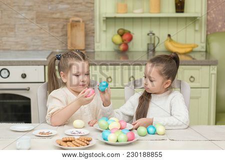 Cute Smiling Kids Holding Painted Easter Eggs.