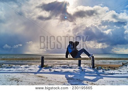 Bannow County Wexford Ireland In February 28 2018; Backpacker Adventural Enjoying Sunny Snow Beach V