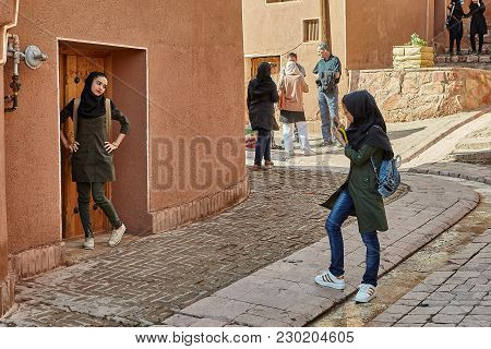 Abyaneh, Iran - April 26, 2017: Young Women Take Photos In The Traditional Countryside In The Mounta