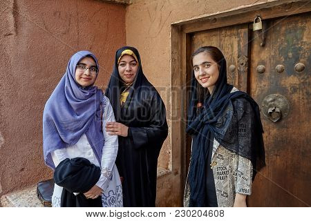 Abyaneh, Iran - April 26, 2017: Three Young Iranian Women In Hijabs In A Traditional Village In The 