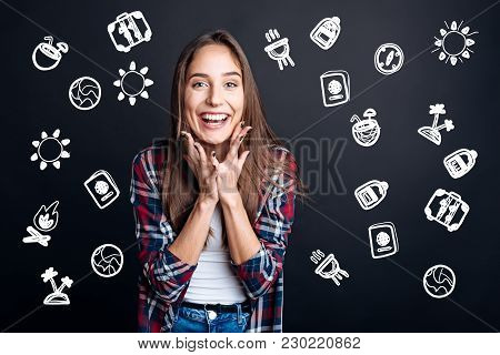 Feeling Happy. Positive Emotional Young Woman Feeling Excited And Smiling While Waiting For Her Summ