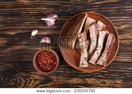 Sliced Spicy Air Dried Speck On Clay Plate