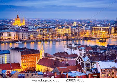 Budapest, Hungary. Szechenyi Chain Bridge And Basilica Sf. Stephen Over Danube River.