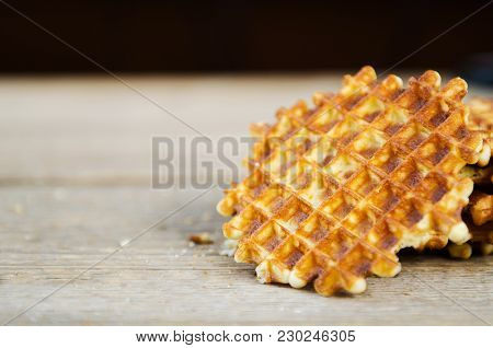 Homemade Fresh Waffles Stacked On A Wooden Table Black Background