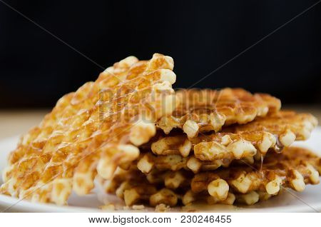 Homemade Fresh Waffles Stacked On A Wooden Table Black Background
