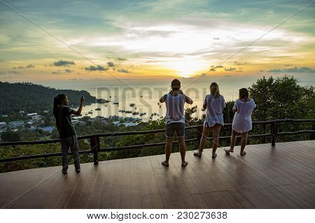 Kohtao Thailand - March 3,2018 : Unidentified Tourist Taking A Photogrpah At Sunset Viewpoint On Hig