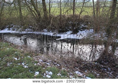 View Of A Small Stream In Winter