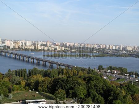 Panorama Of Kiev With Paton Bridge Across The Dnieper River. Kiev Cityscape Is Made From The Observa