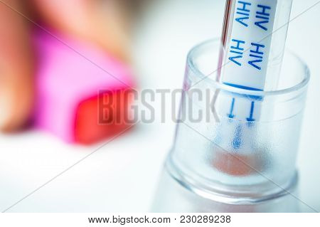 Focus On An Hiv Self-test And Its Lancing Device On White Background