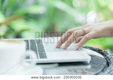 Asian Woman Hands And Married Ring Has Touching And Typing On Laptop Computer With Blurred Coffee, C
