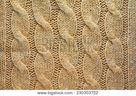 Knit Texture of Beige Wool Knitted Fabric with Cable Knits Pattern. Blank Background