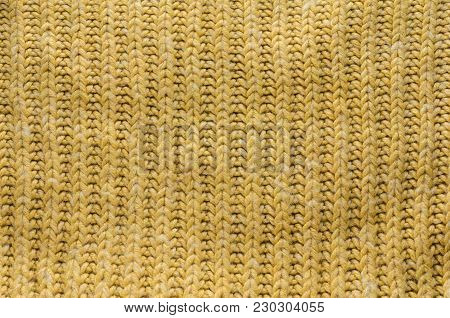 Texture of Yellow Knitted Sweater with Regular Pattern. Knit Texture Blank Background.